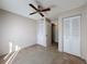 Neutral bedroom with ceiling fan and closet space at 13103 Cypress Hill Dr # B2, Hudson, FL 34669