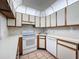 Functional kitchen with bright white appliances and ample counter space at 13103 Cypress Hill Dr # B2, Hudson, FL 34669
