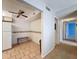 Bright kitchen nook with tile floors, ceiling fan, and decorative floral border at 13103 Cypress Hill Dr # B2, Hudson, FL 34669