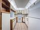 Cozy kitchen featuring white appliances and ample cabinet space at 13103 Cypress Hill Dr # B2, Hudson, FL 34669