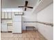 Bright kitchen nook with tile floors and white appliances at 13103 Cypress Hill Dr # B2, Hudson, FL 34669