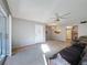 Bright condo with a large living space, sliding doors to porch, kitchen view and light-colored paint at 13103 Cypress Hill Dr # B2, Hudson, FL 34669