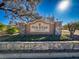 Entrance sign to Pine Ridge at Sugar Creek, a deed restricted community with well-maintained landscaping at 13103 Cypress Hill Dr # B2, Hudson, FL 34669