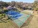 Aerial view of the community tennis and pickleball courts in a well-maintained green space at 13103 Cypress Hill Dr # B2, Hudson, FL 34669