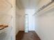 Spacious walk-in closet with shelving offers ample storage for your wardrobe and personal belongings at 13103 Cypress Hill Dr # B2, Hudson, FL 34669