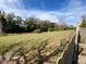 Expansive, well-maintained grassy backyard with a partial fence, great for outdoor activities and relaxation at 1817 Dartmouth Dr, Holiday, FL 34691