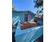Backyard featuring a patio area and blue retaining walls, perfect for entertaining at 1817 Dartmouth Dr, Holiday, FL 34691
