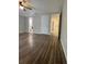 Bedroom with wood-look flooring and two closets at 1817 Dartmouth Dr, Holiday, FL 34691