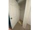 An empty walk-in closet with rod for hanging clothes at 1817 Dartmouth Dr, Holiday, FL 34691