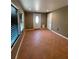 Entryway with tile flooring, a front door with inset window, and two windows with blinds at 1817 Dartmouth Dr, Holiday, FL 34691