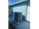 Exterior view of the side of the home featuring HVAC unit and access door at 1817 Dartmouth Dr, Holiday, FL 34691
