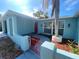Charming single-story home with a red front door and manicured landscaping at 1817 Dartmouth Dr, Holiday, FL 34691