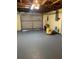 Spacious garage with ample storage space and a functional overhead door for convenient access at 1817 Dartmouth Dr, Holiday, FL 34691