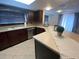 Kitchen with a breakfast bar and stainless steel dishwasher at 1817 Dartmouth Dr, Holiday, FL 34691