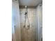 Shower stall with dual shower heads and marble tile surround at 1817 Dartmouth Dr, Holiday, FL 34691