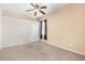 Bedroom with neutral carpet, ceiling fan and light fixture at 1824 Mountain Ash Way, New Port Richey, FL 34655