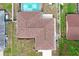 Bird's eye view of roof and backyard with pool, plus neighboring properties at 2013 Meredith Dr, Spring Hill, FL 34608