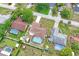 Aerial view of a neighborhood with multiple homes, each featuring private swimming pools and well-kept yards at 2013 Meredith Dr, Spring Hill, FL 34608