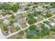 Lovely aerial view of a single-Gathering home with a private pool and lush landscaping in a suburban neighborhood at 2013 Meredith Dr, Spring Hill, FL 34608