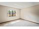 Bright bedroom with a large window and neutral carpet at 2013 Meredith Dr, Spring Hill, FL 34608