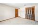 Bedroom featuring light-colored carpet, trim and walls plus closet at 2013 Meredith Dr, Spring Hill, FL 34608