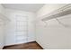 Walk-in closet featuring wire shelving, offering ample storage space and organization options at 2013 Meredith Dr, Spring Hill, FL 34608