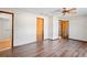 Spacious bedroom featuring wood-look floors, and ceiling fan at 2013 Meredith Dr, Spring Hill, FL 34608