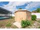 Backyard shed next to a screened in pool at 2013 Meredith Dr, Spring Hill, FL 34608