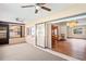 Sunroom with ceiling fans, bar, and sliding glass doors at 2013 Meredith Dr, Spring Hill, FL 34608