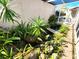 Enclosed atrium featuring lush greenery, decorative rocks, and a small bridge over a water feature at 355 Royal Palm Way, Spring Hill, FL 34608