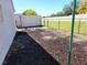 Large backyard with a chain link fence and space to enjoy the outdoors at 355 Royal Palm Way, Spring Hill, FL 34608