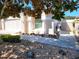 Charming home with beautiful landscaping, featuring rock accents, and a well-manicured walkway at 355 Royal Palm Way, Spring Hill, FL 34608
