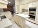 Open kitchen featuring a center island and stainless steel appliances, ideal for cooking at 355 Royal Palm Way, Spring Hill, FL 34608