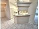 Kitchen area featuring an eat-in bar and an open view of the spacious layout at 355 Royal Palm Way, Spring Hill, FL 34608