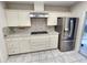 Updated kitchen featuring stainless steel appliances and light countertops at 355 Royal Palm Way, Spring Hill, FL 34608