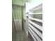Spacious walk-in closet with built-in shelves, clothing rods, and drawer storage at 355 Royal Palm Way, Spring Hill, FL 34608