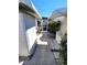 Charming walkway with stone accents leading to the screened patio, offering a delightful outdoor experience at 355 Royal Palm Way, Spring Hill, FL 34608