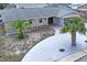 Aerial view of a charming home showcases the well-kept lawn, landscaping and roof at 3736 Sail Dr, New Port Richey, FL 34652