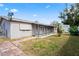 Charming backyard features a covered porch and well-kept lawn, perfect for outdoor enjoyment at 3736 Sail Dr, New Port Richey, FL 34652
