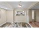 Dining room with hardwood floors, adjacent to a bright kitchen at 3736 Sail Dr, New Port Richey, FL 34652