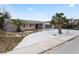 Charming home boasts well-manicured landscaping, mature trees and a convenient garage at 3736 Sail Dr, New Port Richey, FL 34652