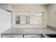 Kitchen pass-through provides views to adjoining rooms, granite counter tops, and stainless dishwasher at 3736 Sail Dr, New Port Richey, FL 34652