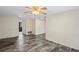 Large living room with hardwood floors and a brick wall, providing a blank canvas for personalization at 3736 Sail Dr, New Port Richey, FL 34652