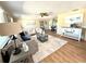 Spacious living room with a comfortable gray sofa, stylish coffee table, decorative accents, and a bright airy atmosphere at 3736 Sail Dr, New Port Richey, FL 34652