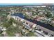 An aerial view shows the waterfront condo complex with canal access to Hudson Beach at 4533 Marine Pkwy # 206, New Port Richey, FL 34652