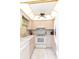 Bright kitchen features white appliances, white cabinetry, and a unique ceiling fan at 4533 Marine Pkwy # 206, New Port Richey, FL 34652