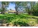 Beautiful backyard with a screened-in pool area and lush greenery, ideal for outdoor enjoyment at 4603 Lake In The Woods Dr, Spring Hill, FL 34607