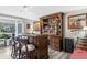 Charming home bar with ample storage and elegant decor, perfect for entertaining guests at 4603 Lake In The Woods Dr, Spring Hill, FL 34607