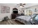 Nautical-themed bedroom featuring luxury vinyl flooring, a ceiling fan, and a window with natural light at 4603 Lake In The Woods Dr, Spring Hill, FL 34607