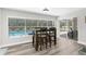 The dining area features lots of natural light and views of the pool and backyard at 4603 Lake In The Woods Dr, Spring Hill, FL 34607